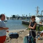 John Schwartz, wife Sandra, big Coast Guard boat, and Connie Brown seated