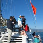 Signals boat with race officials