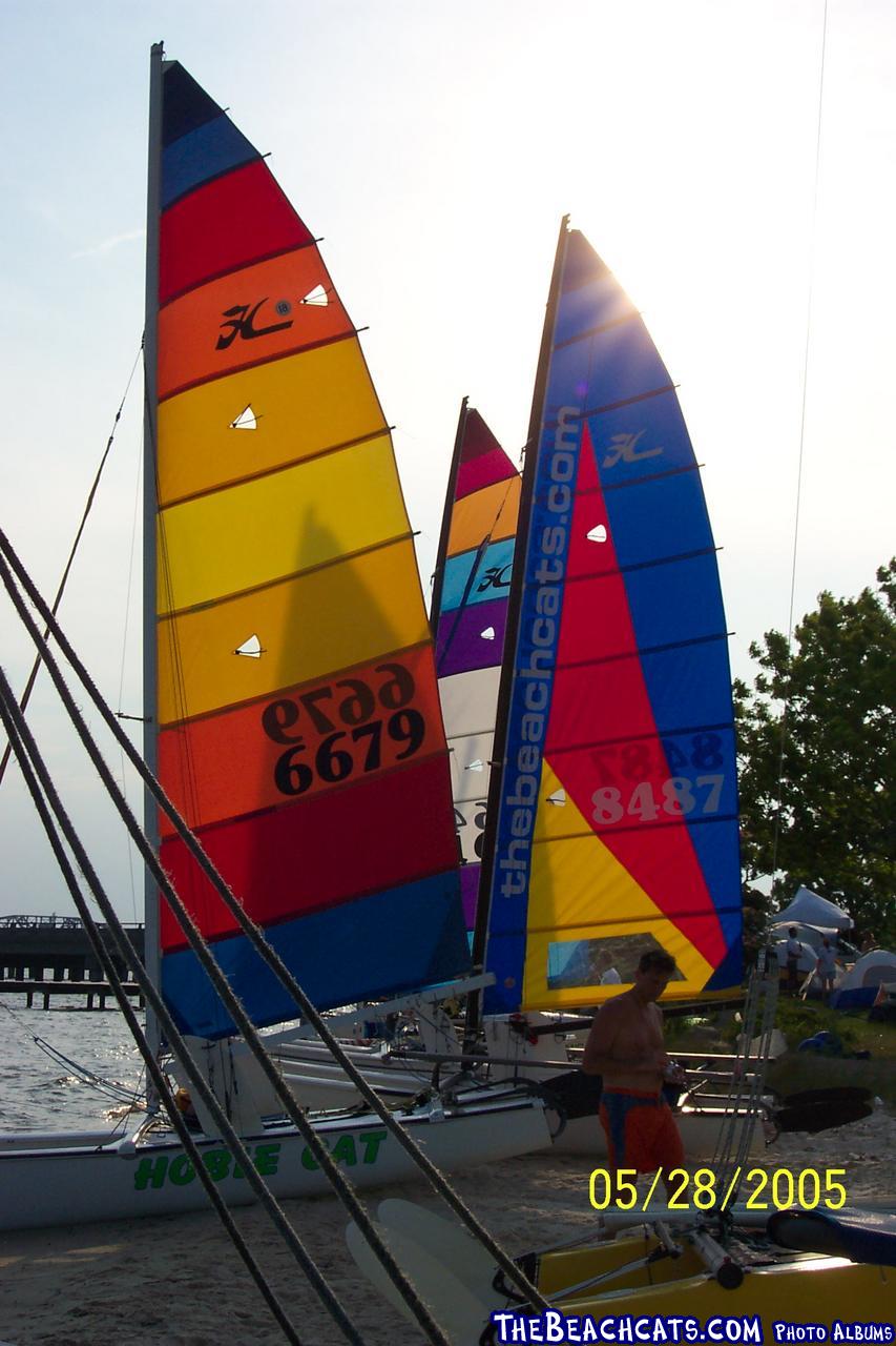 Sun going down behind the sails.