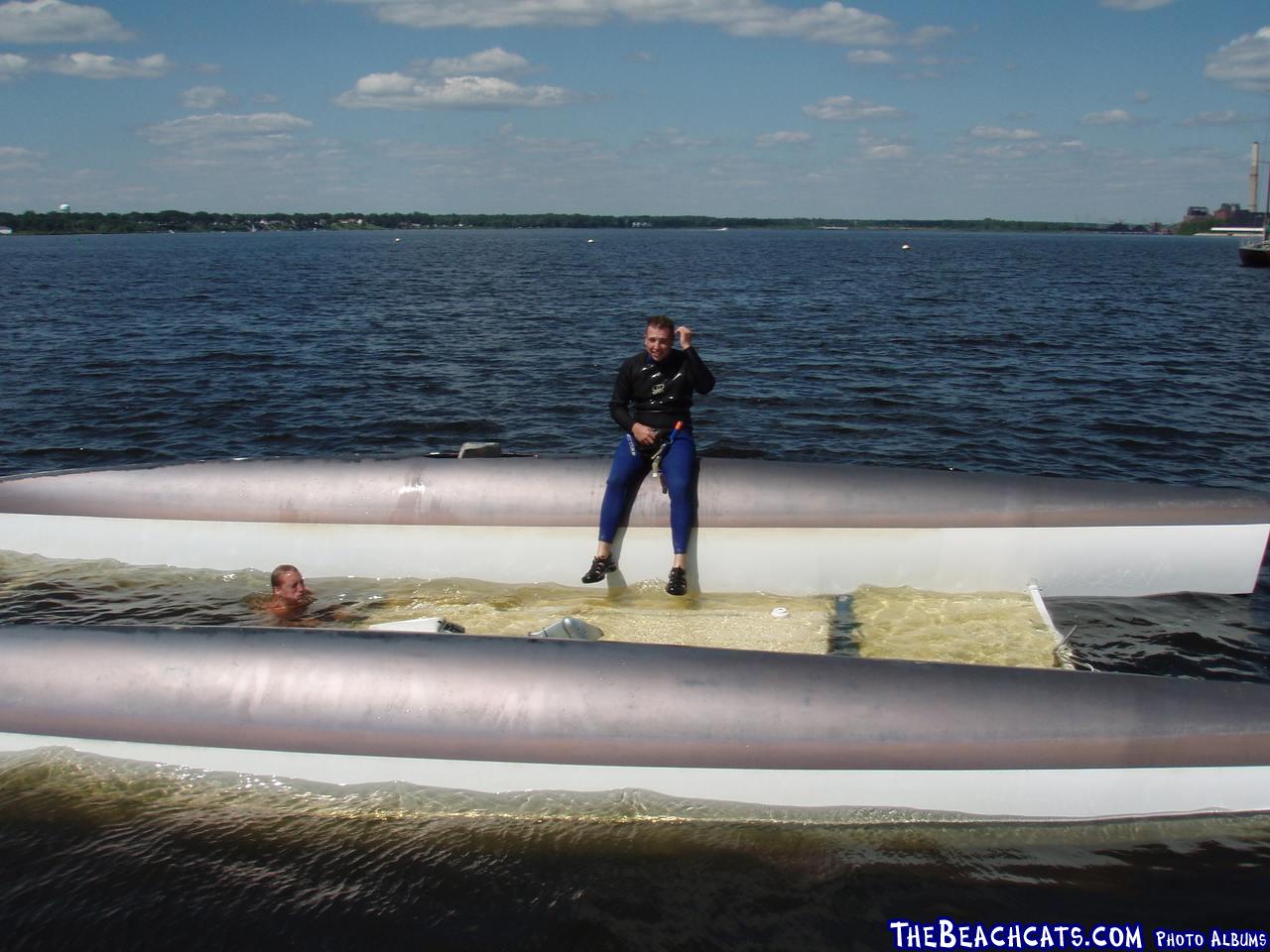 Garret Tenkel on his flipped Stiletto. She was a victim of a waterspout that ripped through the moorings in July 2006.