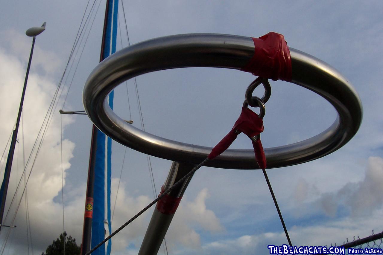 Stainless 1.5in snuffer ring, riveted to 1.5in aluminum pole. The support wire connect to existing Hobie Hull hardware.The head