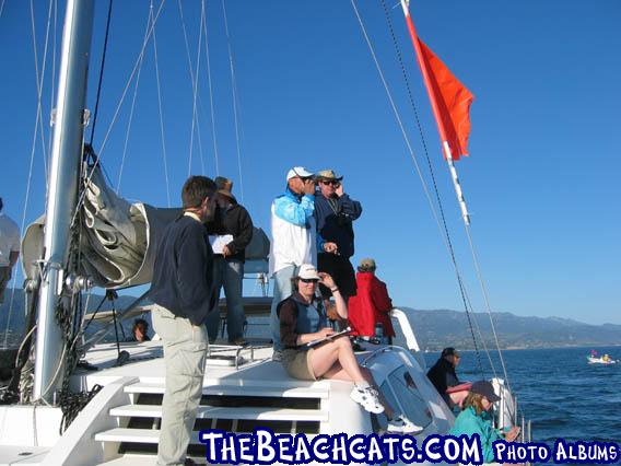 Signals boat with race officials