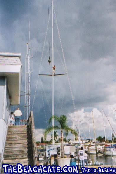 Mark, the owner, finally gets to unhook the mast from the crane. Note the 18' spreaders.