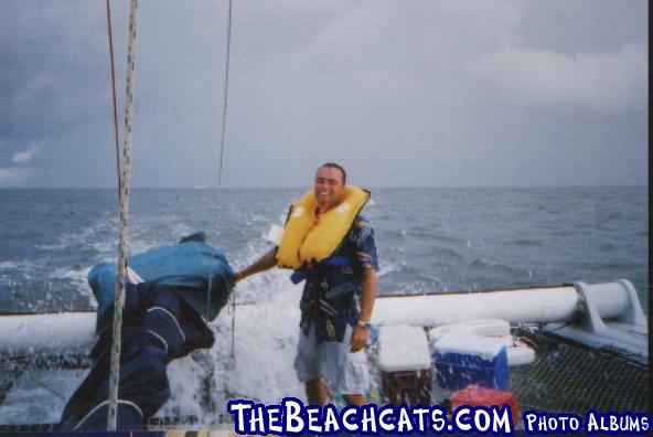 The skipper/owner, Mark, demonstrates to the crew how a auto inflate life vest works.