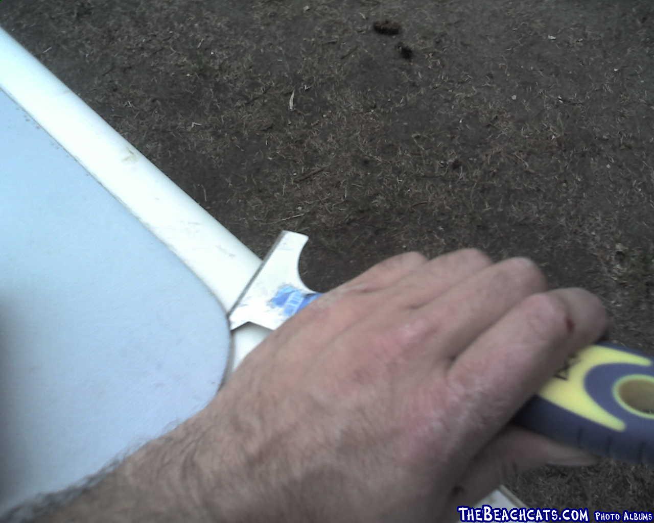 Repair 3
Using a paint scraper to start prying off the deck.