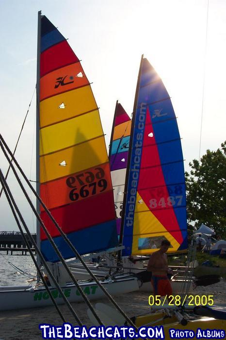 Sun going down behind the sails.